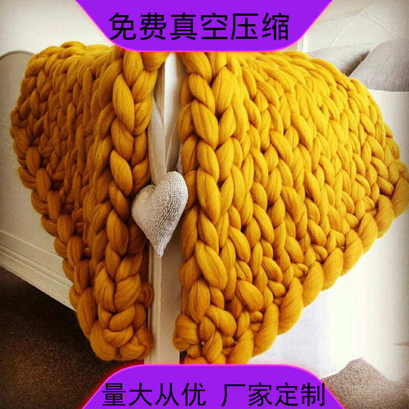 yellow knotte blanket in a white bed