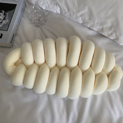 white knotte caterpillar in a white bed