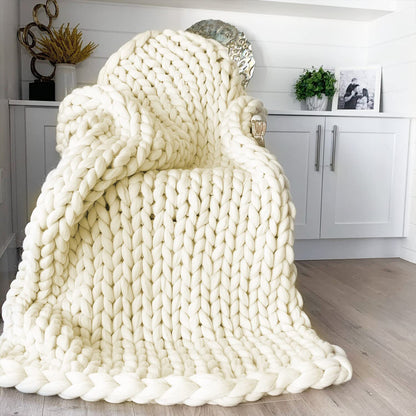 white knotte blanket in a chair