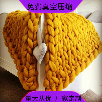 yellow knotte blanket in a white bed