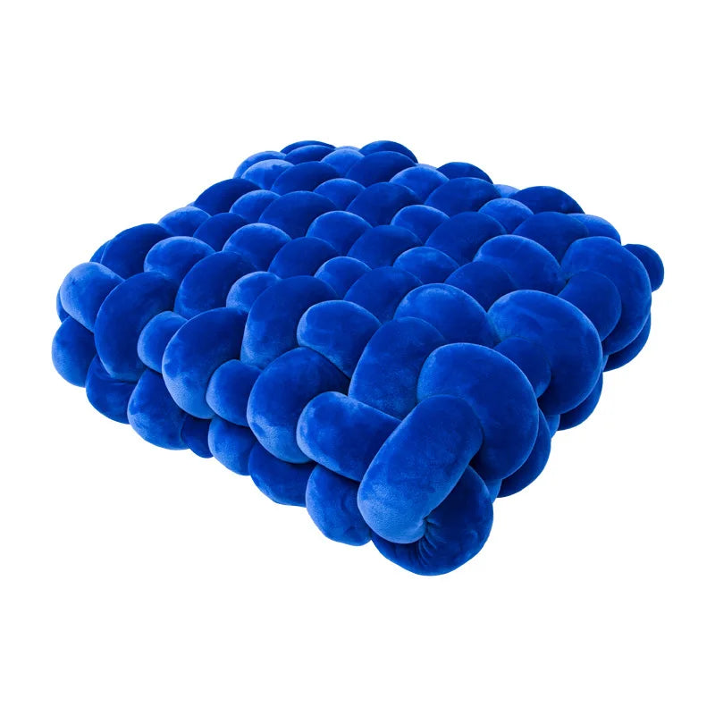 Dark Blue square knotte cushion on a white background